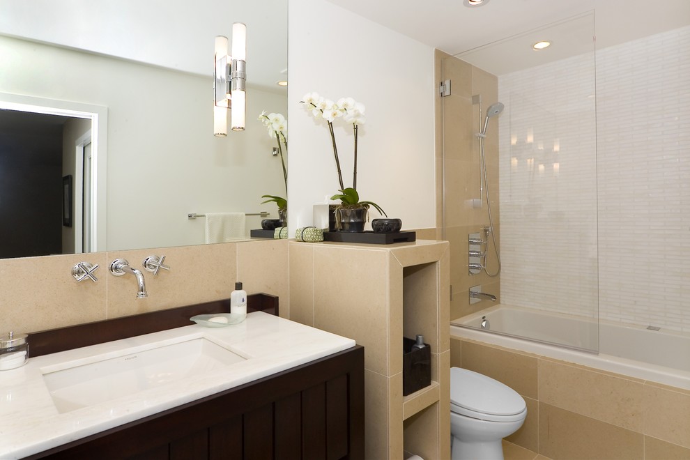 Example of a trendy beige tile bathroom design in San Francisco with dark wood cabinets