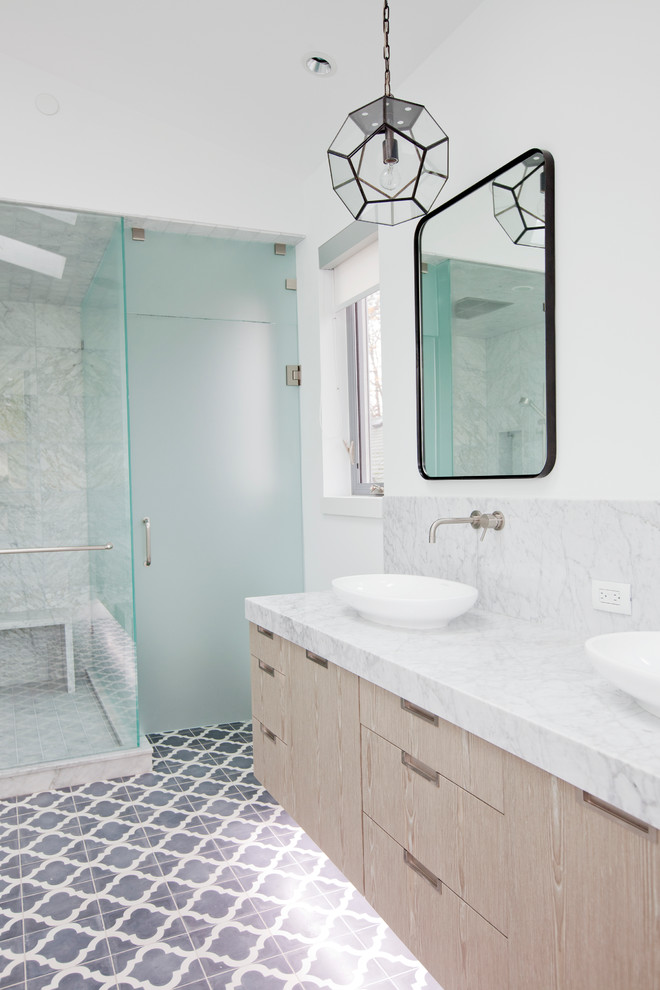 Design ideas for a large contemporary family bathroom in Vancouver with flat-panel cabinets, medium wood cabinets, marble worktops, grey tiles, stone tiles, white walls and a vessel sink.