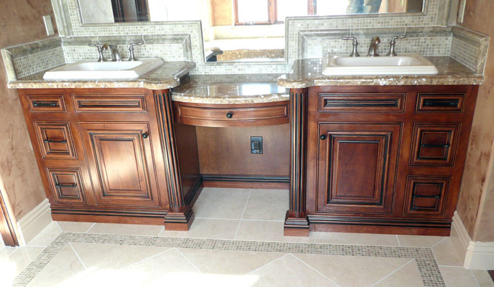 Bathroom in Sacramento with beaded cabinets and medium wood cabinets.