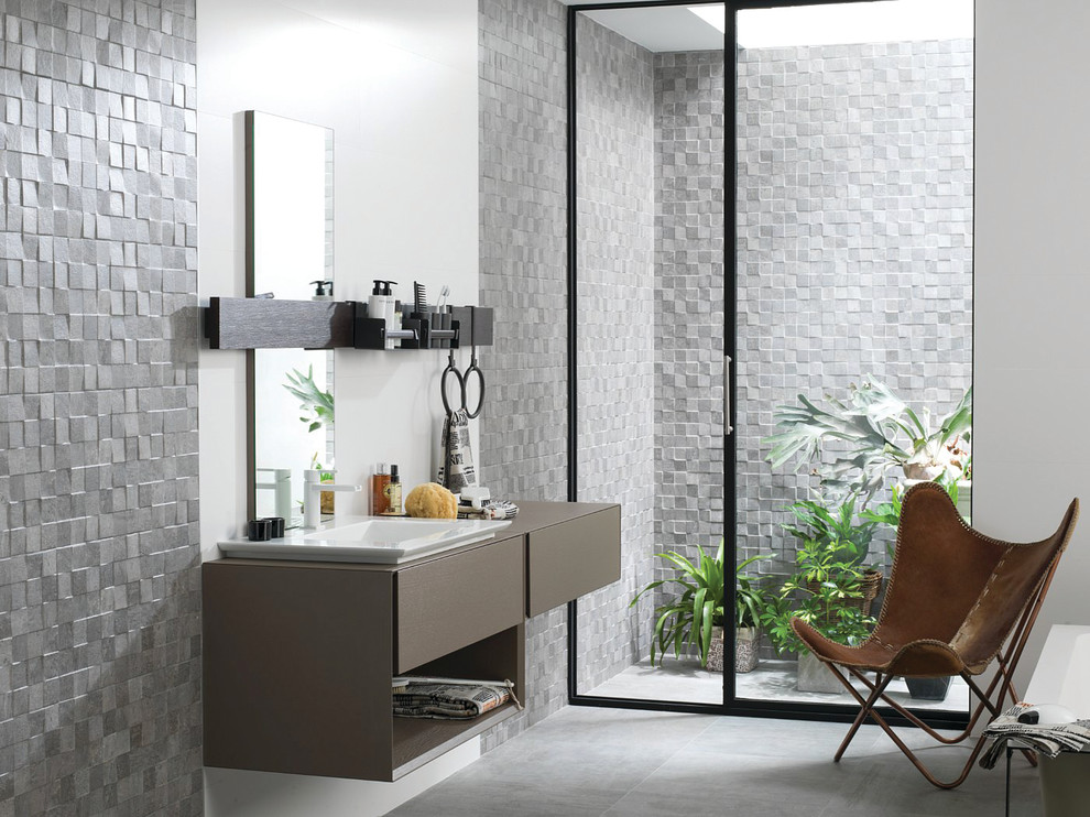 Medium sized traditional shower room bathroom in Austin with flat-panel cabinets, brown cabinets, grey tiles, grey walls, porcelain flooring, a vessel sink, solid surface worktops and stone slabs.