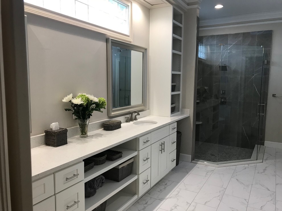 Expansive classic ensuite bathroom in Jacksonville with shaker cabinets, white cabinets, a freestanding bath, a corner shower, a two-piece toilet, grey tiles, porcelain tiles, grey walls, porcelain flooring, a submerged sink, engineered stone worktops, white floors, a hinged door and white worktops.