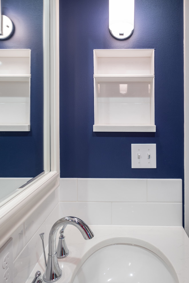 Bathroom - mid-sized traditional master white tile and ceramic tile porcelain tile bathroom idea in Portland with recessed-panel cabinets, white cabinets, a two-piece toilet, blue walls, an undermount sink and quartz countertops