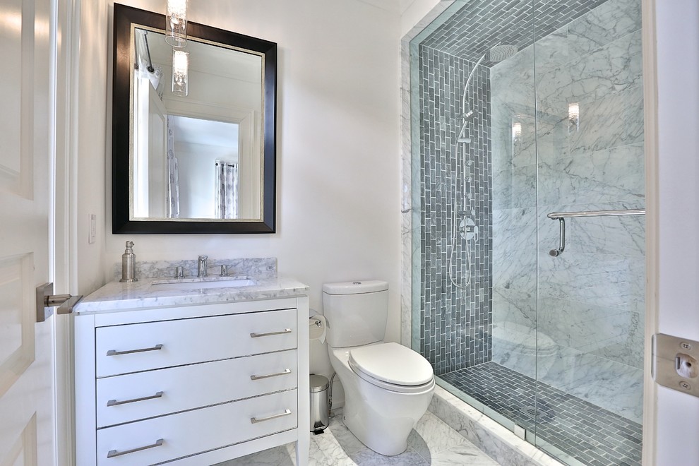 Medium sized contemporary shower room bathroom in Toronto with flat-panel cabinets, white cabinets, an alcove shower, grey tiles, marble tiles, beige walls, marble flooring, a submerged sink, grey floors and a hinged door.