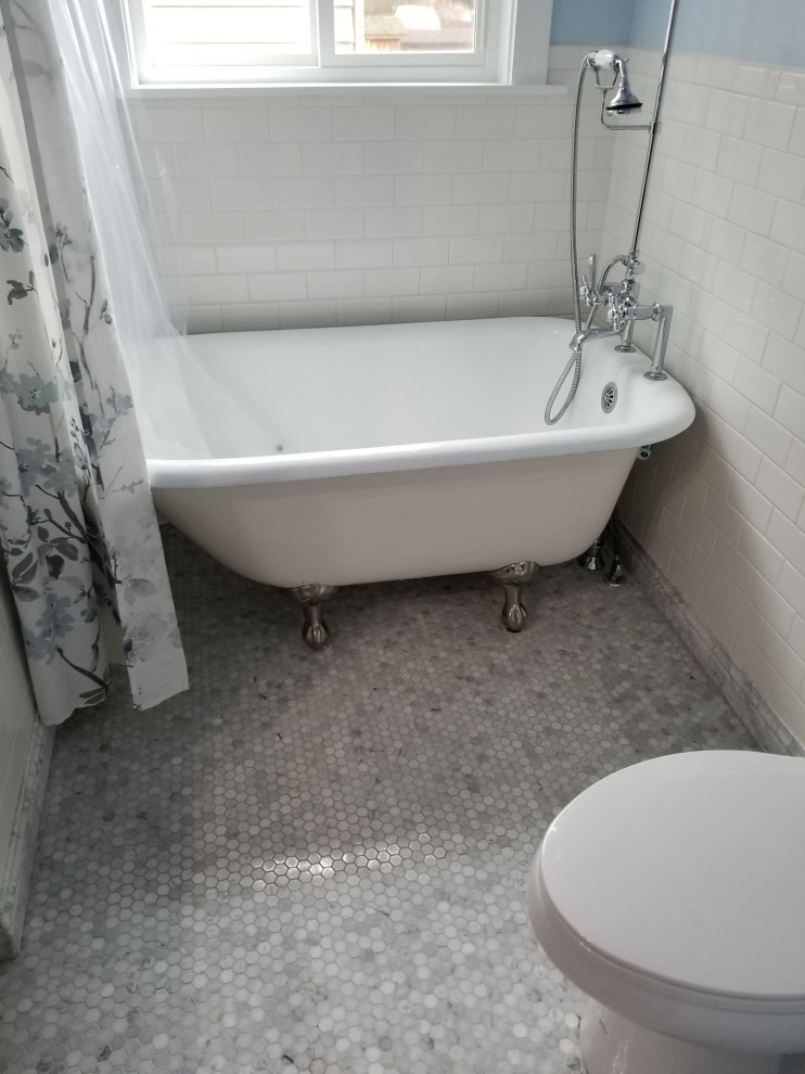 Small arts and crafts 3/4 linoleum floor and single-sink bathroom photo in Seattle with recessed-panel cabinets, white cabinets, quartz countertops, black countertops and a freestanding vanity