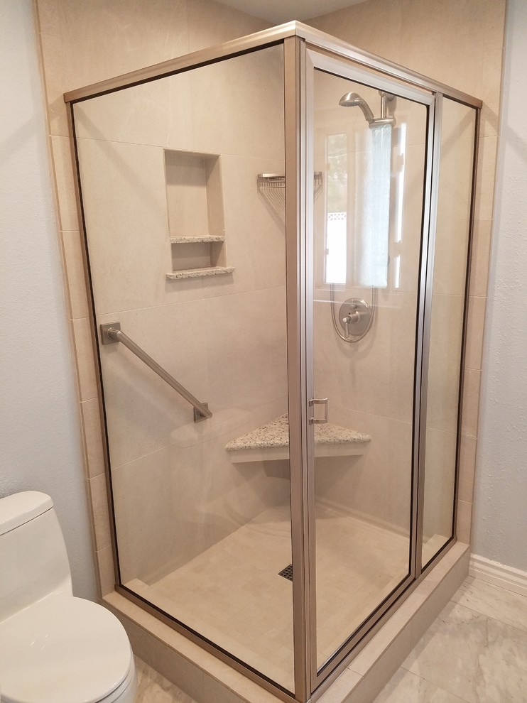 Design ideas for a traditional shower room bathroom in Los Angeles with a corner shower, beige tiles, porcelain tiles, porcelain flooring, beige floors and a hinged door.