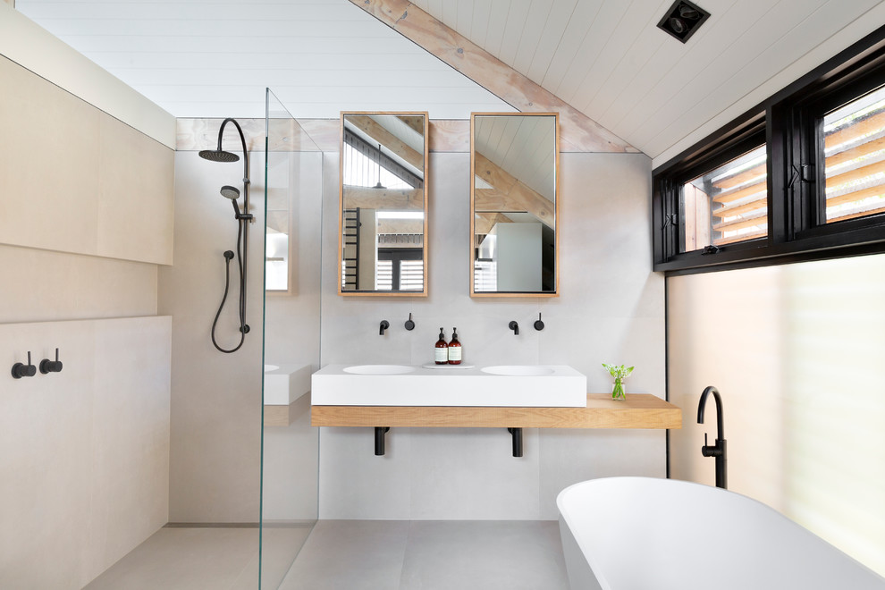 Danish bathroom photo in Melbourne with an integrated sink, wood countertops and beige countertops
