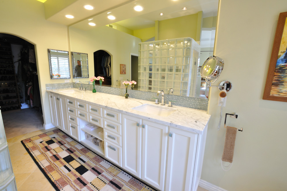 Bathroom - mid-sized transitional master ceramic tile bathroom idea in Orange County with recessed-panel cabinets, white cabinets, beige walls, an undermount sink and granite countertops