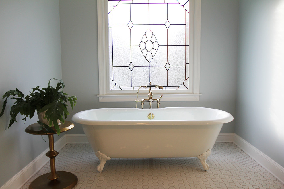 Inspiration for a large victorian master white tile and subway tile mosaic tile floor claw-foot bathtub remodel in Atlanta with shaker cabinets, blue cabinets, a two-piece toilet, blue walls, an undermount sink and quartzite countertops