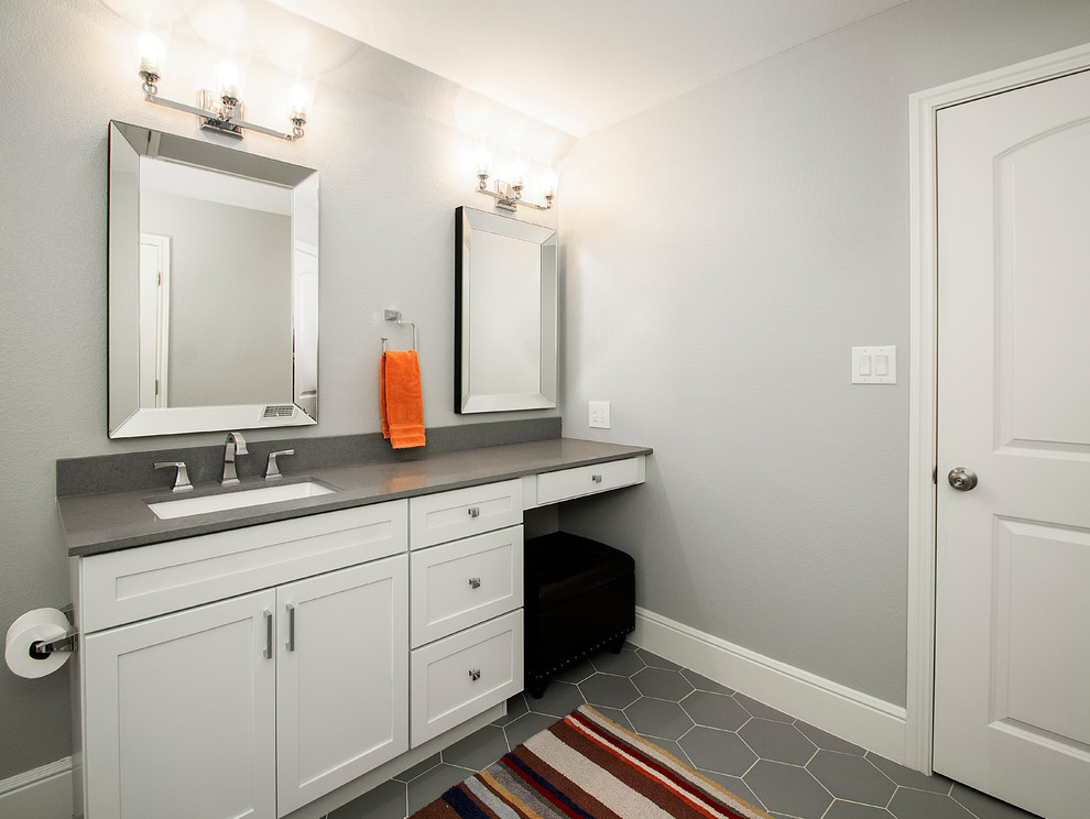 Example of a mid-sized transitional kids' white tile and ceramic tile porcelain tile and gray floor bathroom design in Dallas with flat-panel cabinets, white cabinets, a two-piece toilet, gray walls, an undermount sink, gray countertops and quartz countertops
