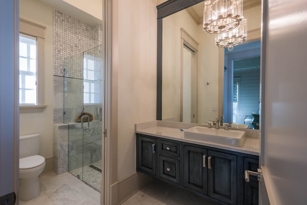 Photo of a medium sized contemporary shower room bathroom in Miami with beaded cabinets, distressed cabinets, a built-in shower, a one-piece toilet, white tiles, stone tiles, white walls, marble flooring, a vessel sink and laminate worktops.