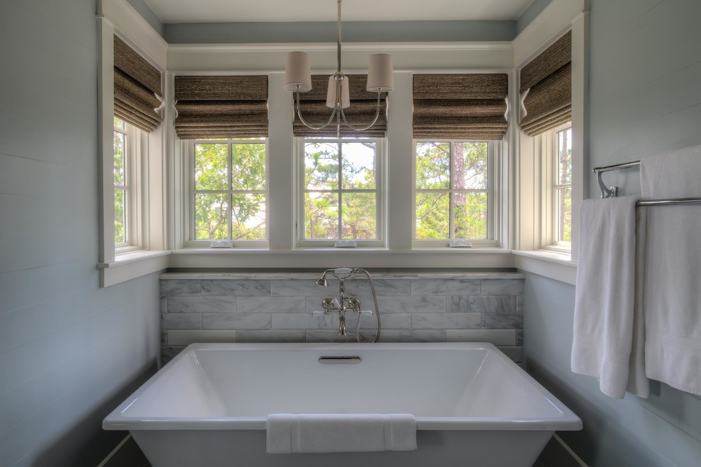 Design ideas for a coastal ensuite bathroom in Atlanta with a submerged sink, recessed-panel cabinets, white cabinets, marble worktops, a freestanding bath, a corner shower, grey tiles, stone tiles, blue walls and mosaic tile flooring.