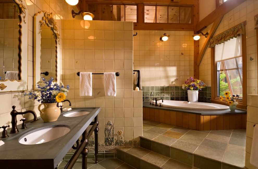 На фото: большая главная ванная комната в стиле рустика с накладной ванной, бежевой плиткой, врезной раковиной, разноцветным полом, керамогранитной плиткой, столешницей из талькохлорита и полом из керамогранита с
