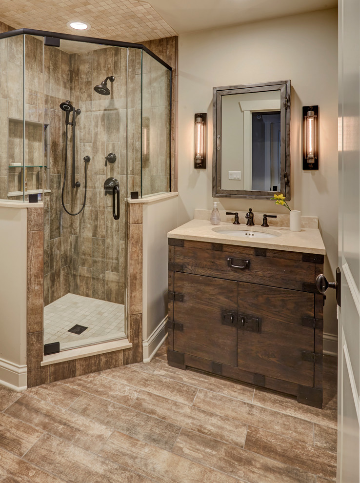 Inspiration for a mid-sized timeless 3/4 beige tile and marble tile light wood floor bathroom remodel in Other with raised-panel cabinets, distressed cabinets, a one-piece toilet, beige walls, a trough sink and granite countertops