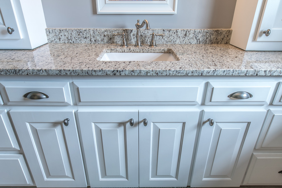 Inspiration for a small traditional shower room bathroom in Nashville with raised-panel cabinets, white cabinets, beige walls, a submerged sink and granite worktops.