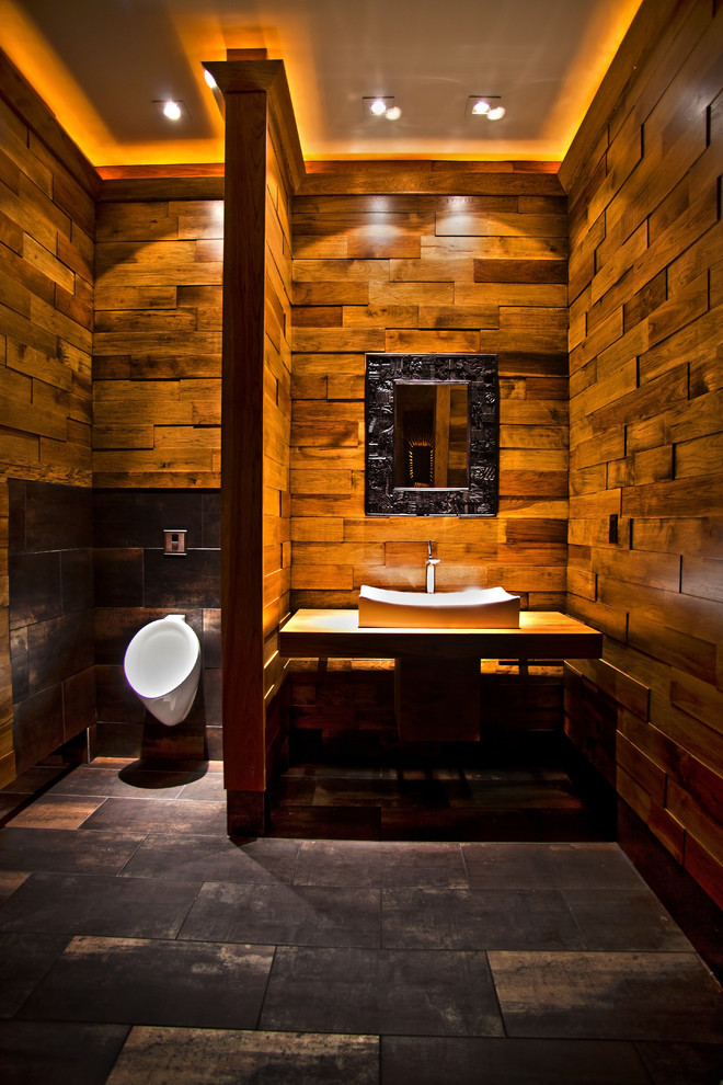 Large contemporary ensuite bathroom in Other with dark wood cabinets, an urinal, brown tiles, brown walls, a vessel sink, wooden worktops and grey floors.
