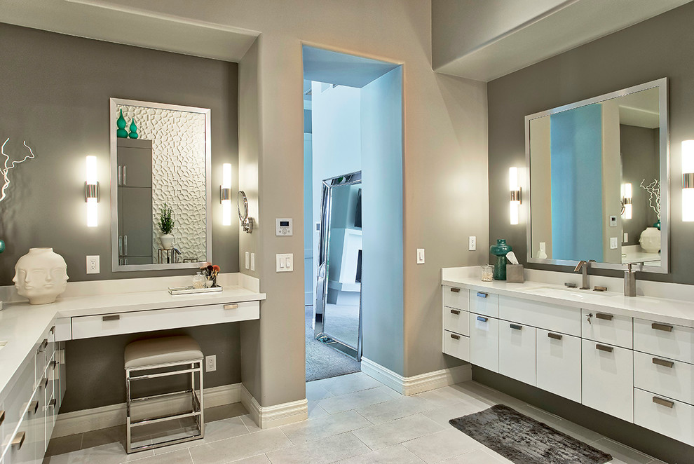 Inspiration for a huge contemporary master gray floor bathroom remodel in Phoenix with flat-panel cabinets, white cabinets, gray walls, a drop-in sink and white countertops
