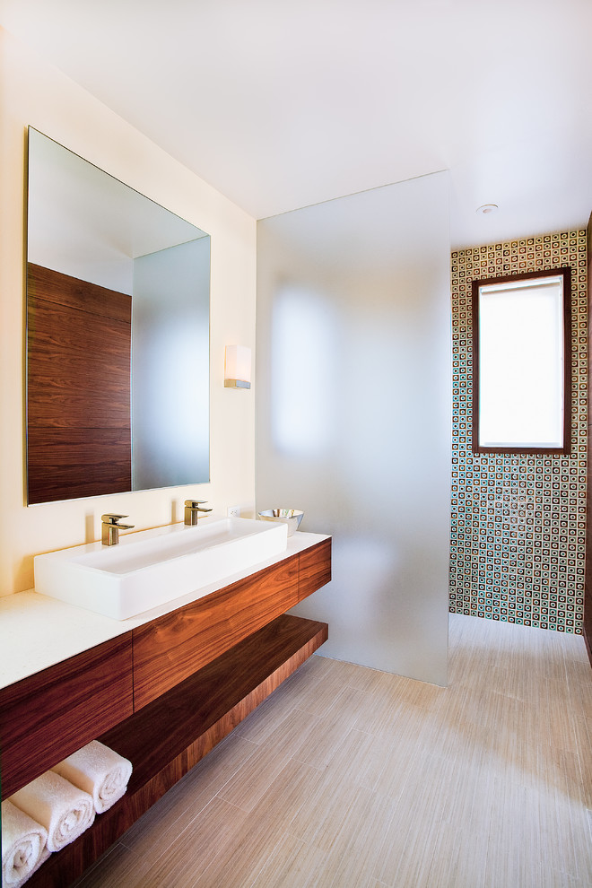 Inspiration for a large timeless 3/4 beige tile and ceramic tile ceramic tile bathroom remodel in Santa Barbara with a trough sink, flat-panel cabinets, light wood cabinets, limestone countertops, an undermount tub, a one-piece toilet and yellow walls