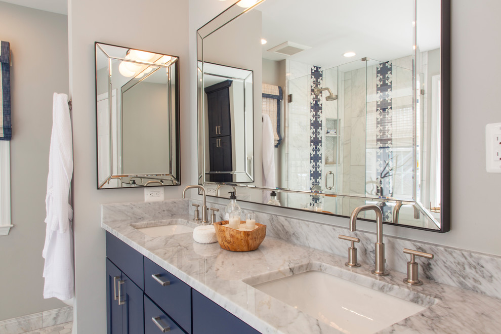 Small classic ensuite bathroom in DC Metro with shaker cabinets, blue cabinets, marble tiles, grey walls, marble flooring, a submerged sink, marble worktops, grey floors and grey worktops.