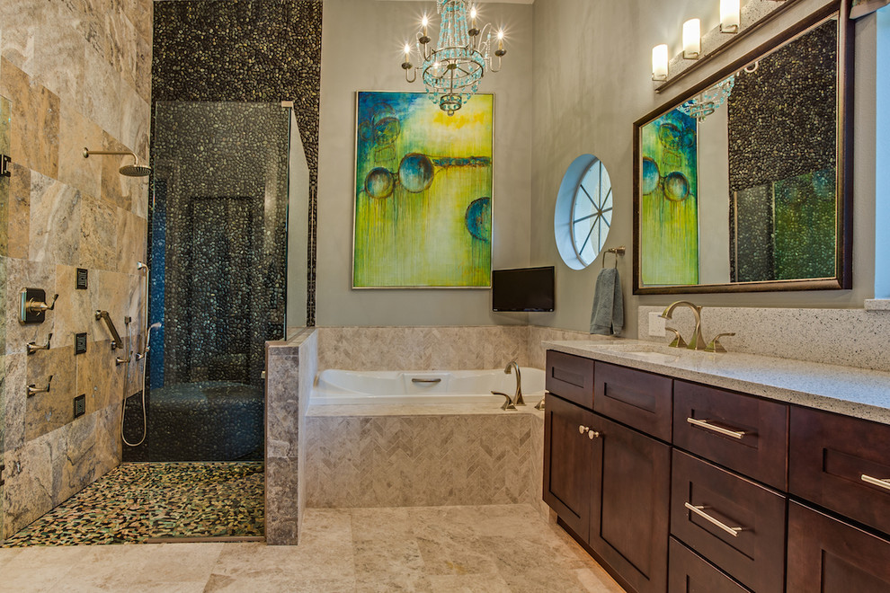 Example of a mid-sized mountain style master black tile and pebble tile ceramic tile and brown floor bathroom design in Orlando with shaker cabinets, dark wood cabinets, an undermount sink, granite countertops and a hinged shower door