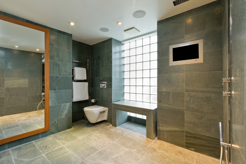 Inspiration for a contemporary bathroom in London with a wall mounted toilet.