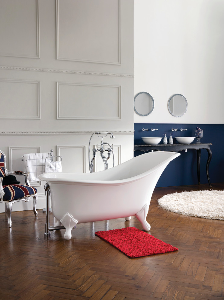 Inspiration for a large classic ensuite bathroom in Other with freestanding cabinets, black cabinets, a claw-foot bath, multi-coloured walls, dark hardwood flooring, a vessel sink, wooden worktops and brown floors.