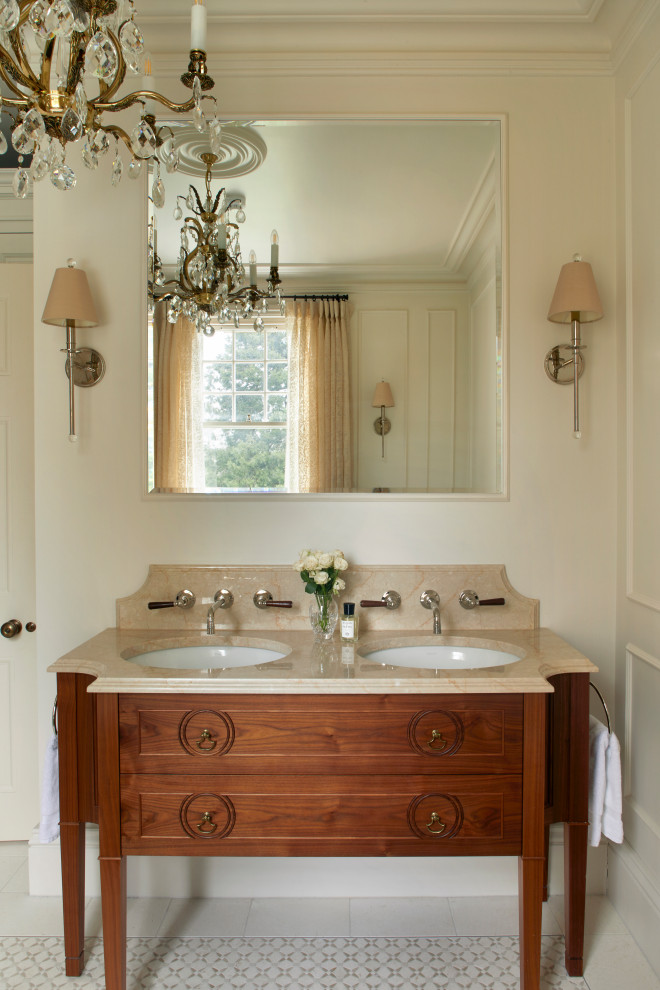 Inspiration for a mid-sized country master mosaic tile floor, beige floor, double-sink and wall paneling bathroom remodel in London with a wall-mount toilet, white walls, a drop-in sink, marble countertops, beige countertops and a freestanding vanity