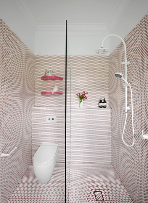 Whimsical Touch: White Penny Tile Bathroom Design with Pink Grout