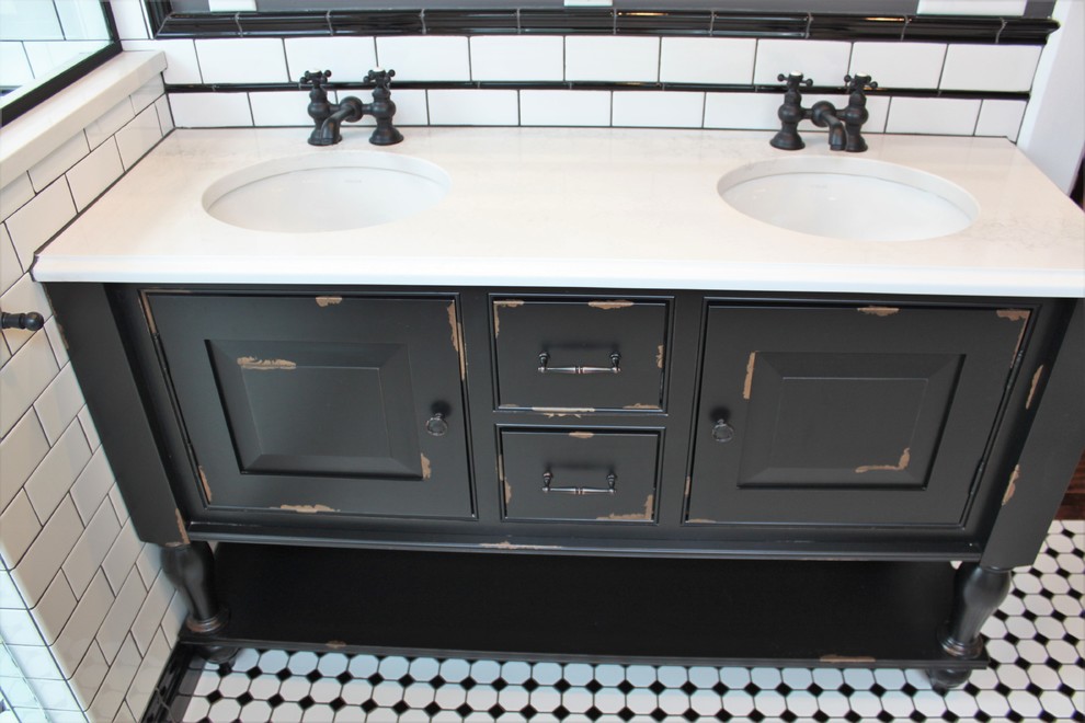 Example of a mid-sized ornate master white tile and ceramic tile porcelain tile and multicolored floor bathroom design in Indianapolis with furniture-like cabinets, black cabinets, a two-piece toilet, gray walls, an undermount sink, quartz countertops, a hinged shower door and white countertops