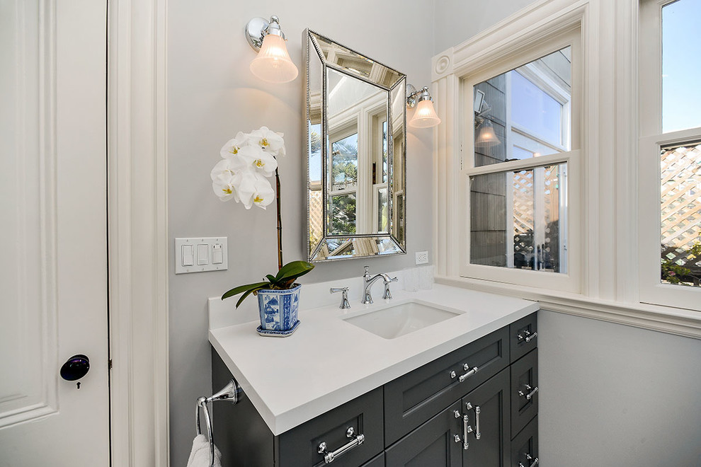 Example of a large ornate master white tile and marble tile marble floor and white floor bathroom design in San Francisco with recessed-panel cabinets, gray cabinets, a two-piece toilet, marble countertops, gray walls, an undermount sink and a hinged shower door
