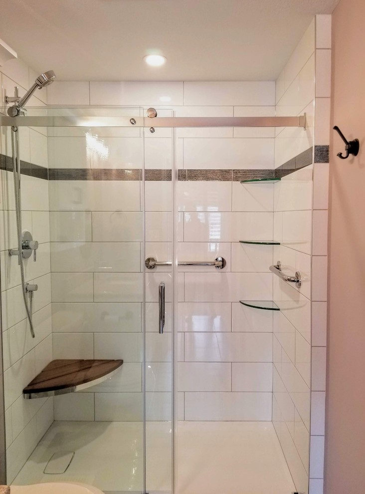 Medium sized traditional shower room bathroom in Toronto with recessed-panel cabinets, white cabinets, an alcove shower, a one-piece toilet, white tiles, metro tiles, purple walls, porcelain flooring, quartz worktops, grey floors, a sliding door, a single sink and a built in vanity unit.