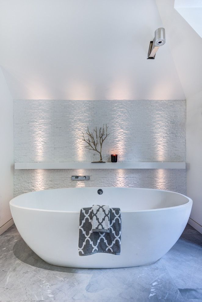 Photo of a classic ensuite bathroom in Toronto with a freestanding bath and a hinged door.