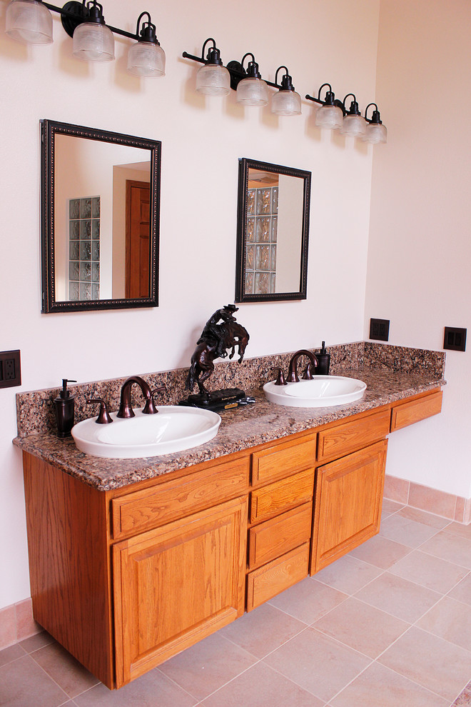 Large traditional ensuite bathroom in Other with raised-panel cabinets.