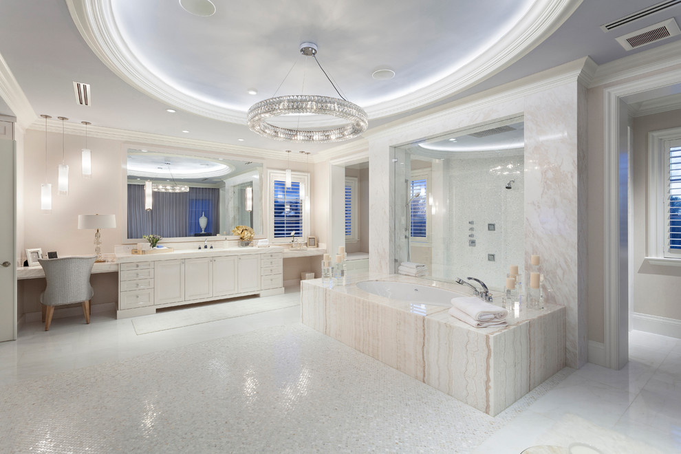 Cette image montre une très grande salle de bain principale design avec un placard à porte shaker, une baignoire encastrée, une douche ouverte, un carrelage beige, mosaïque, un plan de toilette en marbre et des portes de placard blanches.