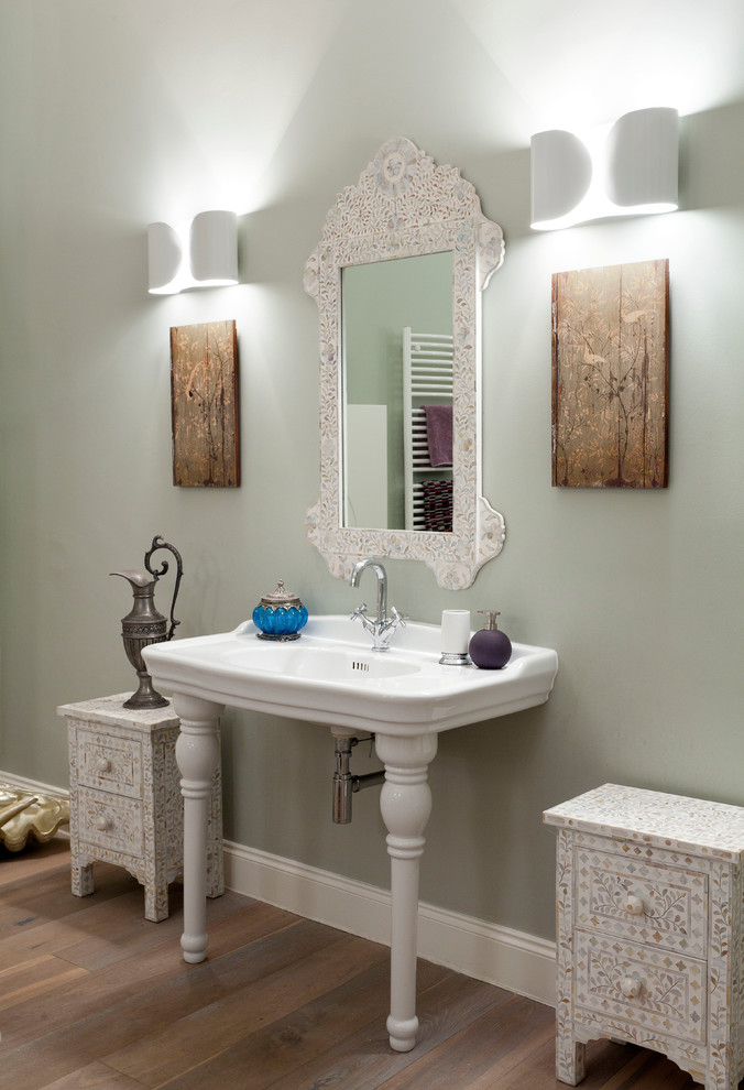 Inspiration for a large victorian medium tone wood floor bathroom remodel in Glasgow with gray walls and a console sink