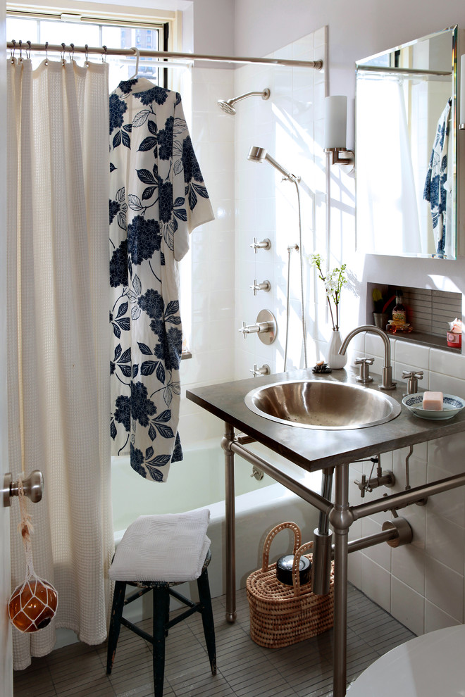 Inspiration for an eclectic bathroom remodel in New York with limestone countertops and a drop-in sink
