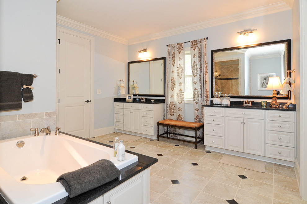 На фото: главная ванная комната среднего размера в классическом стиле с фасадами с выступающей филенкой, белыми фасадами, накладной ванной, бежевой плиткой, синими стенами, полом из керамической плитки, врезной раковиной и столешницей из искусственного камня