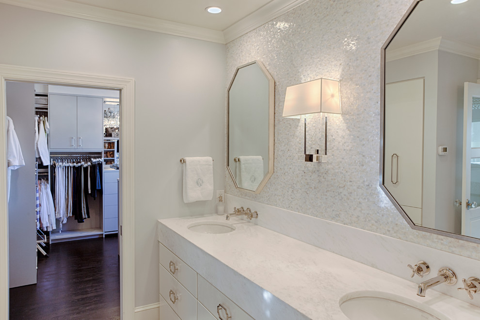 This is an example of a large traditional ensuite bathroom in Philadelphia with freestanding cabinets, white cabinets, a claw-foot bath, an alcove shower, beige tiles, white tiles, mosaic tiles, grey walls, marble flooring, a submerged sink, marble worktops, white floors and a hinged door.