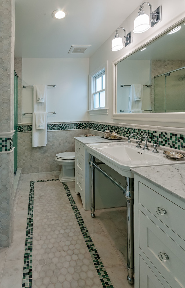 Inspiration for a medium sized classic ensuite half tiled bathroom in San Diego with light wood cabinets, a one-piece toilet, multi-coloured tiles, multi-coloured walls, freestanding cabinets, a corner shower, mosaic tile flooring and a pedestal sink.