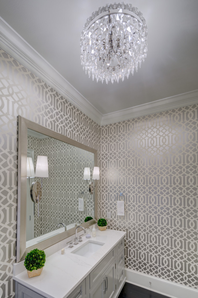 Design ideas for a large traditional bathroom in Atlanta with beaded cabinets, grey cabinets, a two-piece toilet, dark hardwood flooring, a submerged sink, engineered stone worktops, black floors, white worktops, a single sink, a freestanding vanity unit and wallpapered walls.