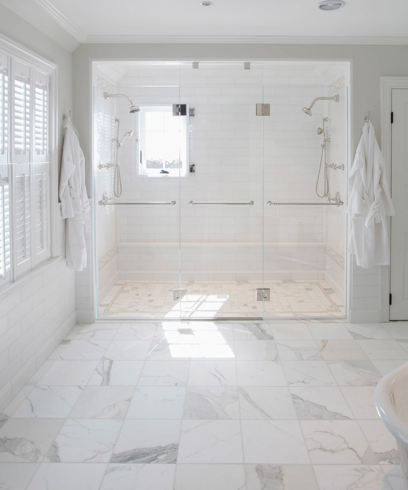 Design ideas for a large traditional ensuite bathroom in Bridgeport with freestanding cabinets, white cabinets, a freestanding bath, an alcove shower, white tiles, marble tiles, white walls, marble flooring, a console sink, marble worktops, white floors, a hinged door and white worktops.