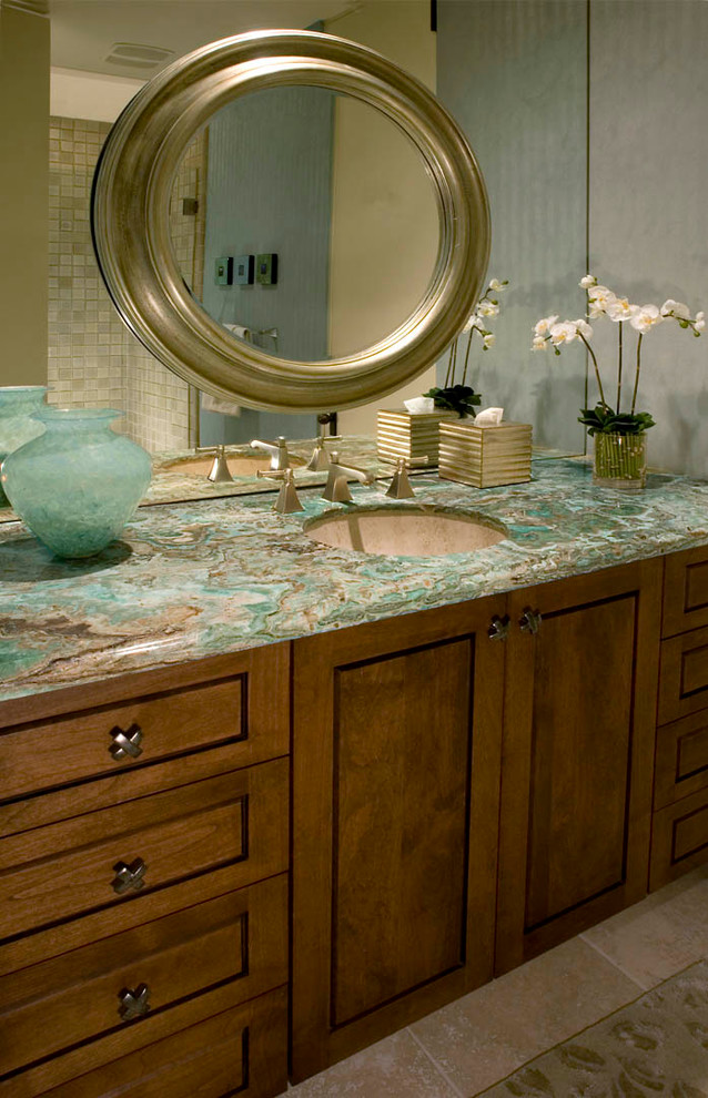 Inspiration for a classic bathroom in Los Angeles with a submerged sink, recessed-panel cabinets, medium wood cabinets, onyx worktops, beige tiles, stone tiles and turquoise worktops.