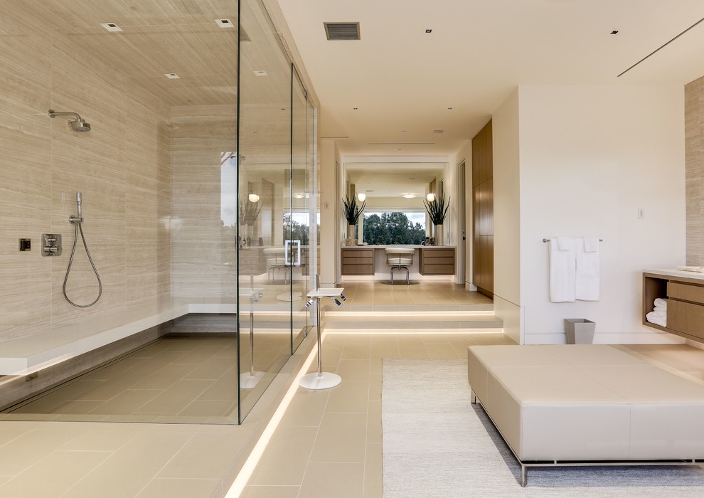 Example of a huge trendy master beige tile porcelain tile and beige floor bathroom design in Los Angeles with flat-panel cabinets, light wood cabinets, beige walls and a hinged shower door