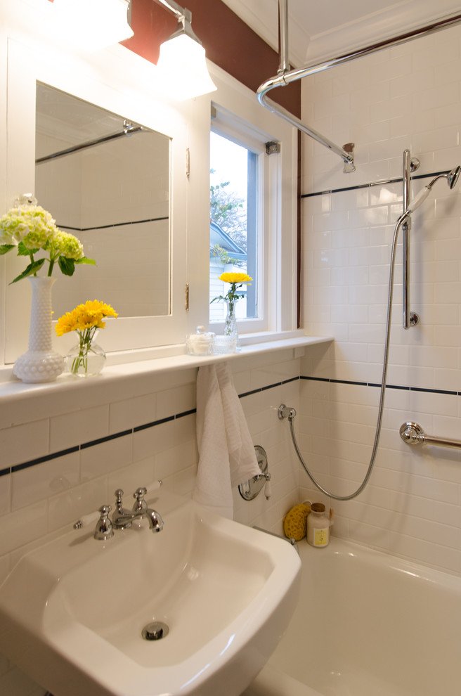 This is an example of a small classic bathroom in Seattle with an alcove bath, white tiles, ceramic tiles, ceramic flooring and a pedestal sink.