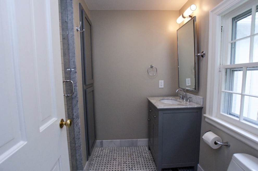 Photo of a small victorian shower room bathroom in Other with a submerged sink, shaker cabinets, grey cabinets, marble worktops, an alcove shower, a one-piece toilet, white tiles, metro tiles, grey walls and mosaic tile flooring.