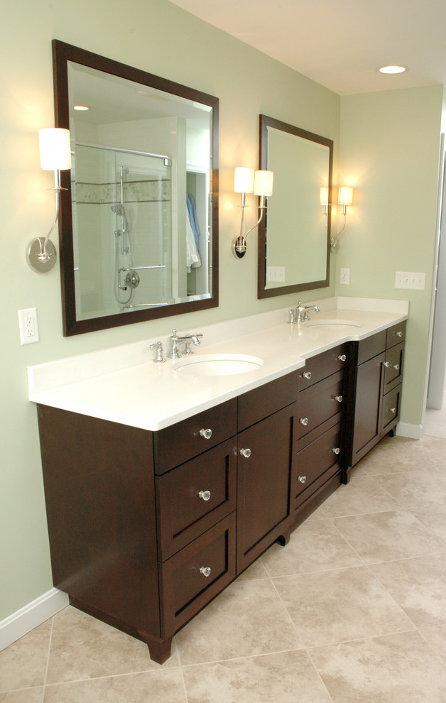 Bathroom - mid-sized traditional master ceramic tile bathroom idea in Cincinnati with an undermount sink, recessed-panel cabinets, dark wood cabinets and green walls
