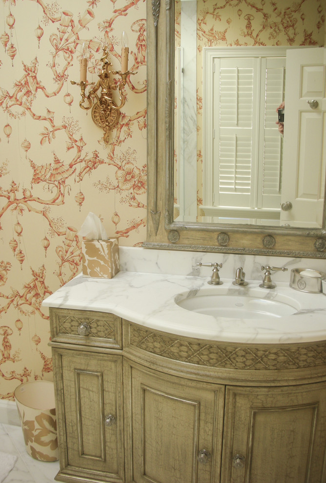 Elegant bathroom photo in DC Metro with furniture-like cabinets and distressed cabinets