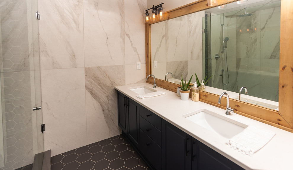Example of a mid-sized minimalist master white tile ceramic tile and gray floor bathroom design in Toronto with furniture-like cabinets, brown cabinets, a one-piece toilet, beige walls, a drop-in sink, granite countertops, a hinged shower door and white countertops