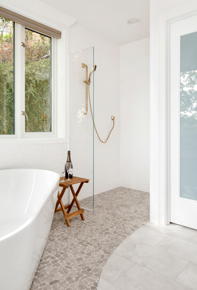 Inspiration for a contemporary bathroom in Portland with white cabinets, a freestanding bath, a walk-in shower, white tiles, white walls, porcelain flooring, grey floors, an open shower, grey worktops and ceramic tiles.