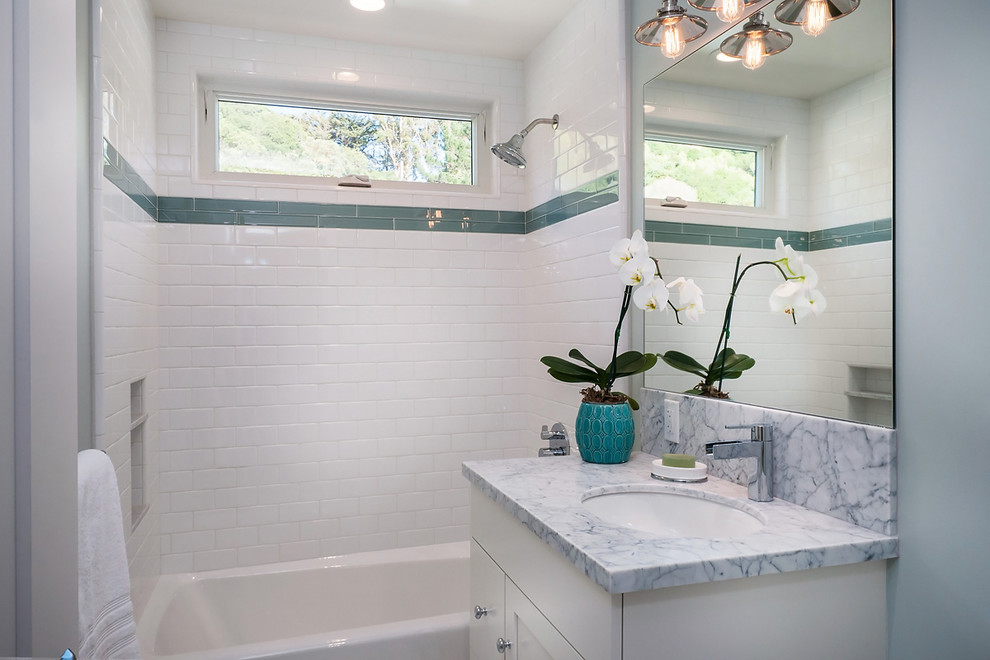 Trendy kids' white tile and subway tile marble floor bathroom photo in San Francisco with recessed-panel cabinets, white cabinets, marble countertops, a one-piece toilet, an undermount sink and green walls