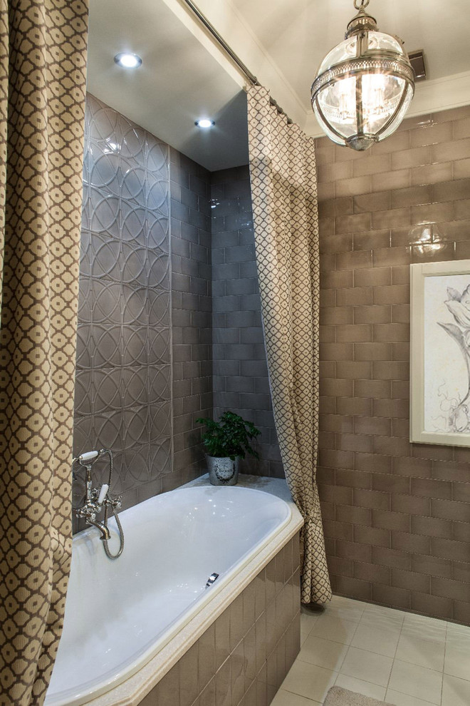 На фото: ванная комната в классическом стиле с накладной ванной, серой плиткой, керамической плиткой, серыми стенами и полом из керамической плитки